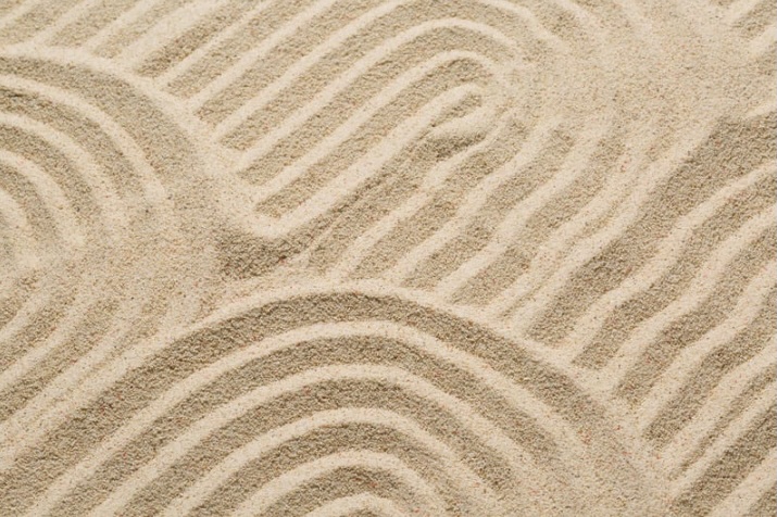 Close-up view of smooth sand with curved patterns, representing the calming and reflective environment used in sand tray therapy sessions at counseling centers in Monmouth County, New Jersey.